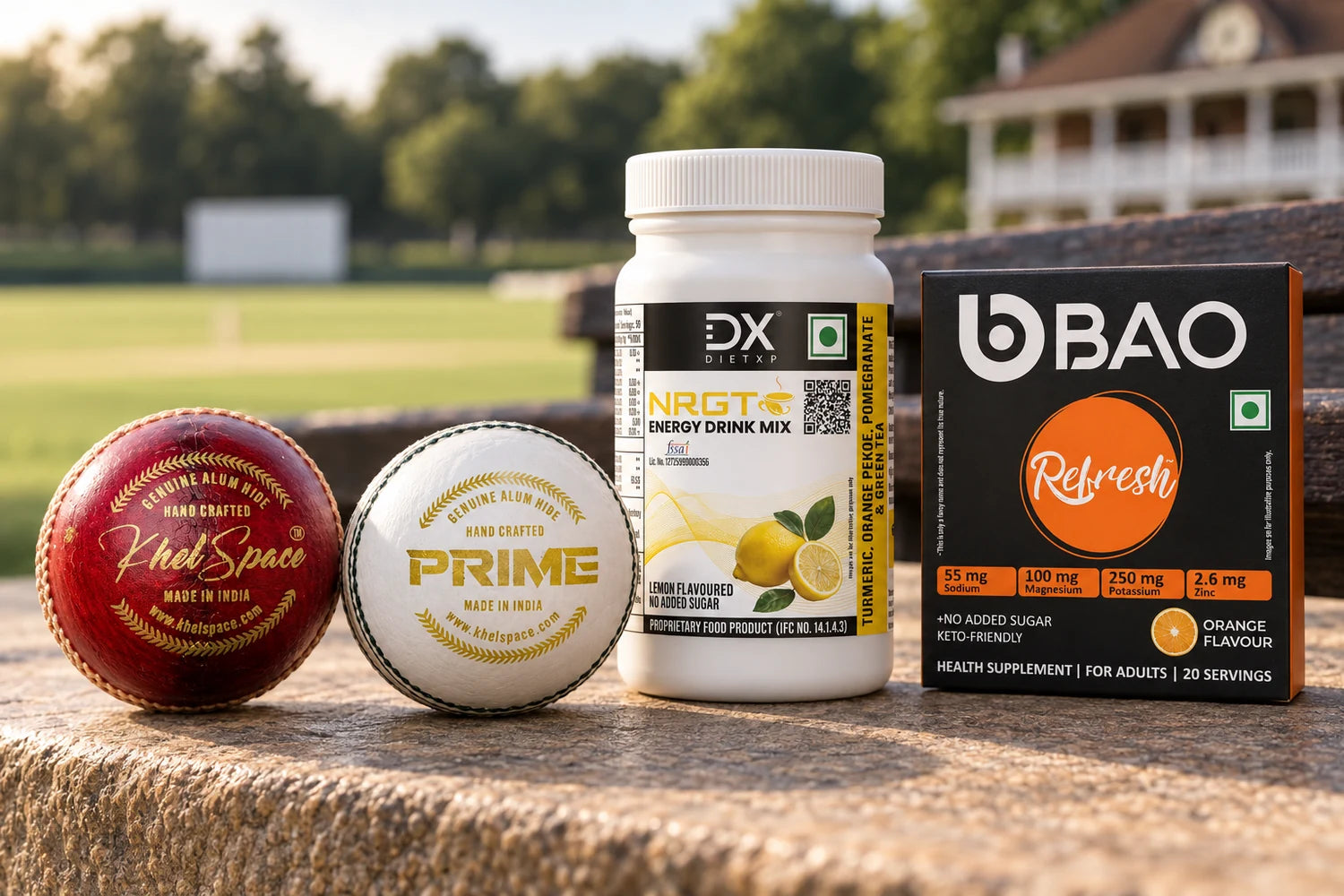 Khelspace red and white cricket balls with DietXP NRGT Lemon and BAO Refresh on a pavilion ledge